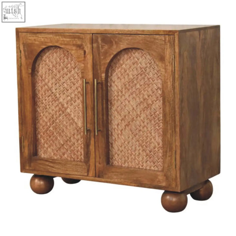 Brown wooden arched rattan two-door sideboard with woven cane panels and brass handles on rounded feet