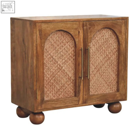 Brown wooden arched rattan two-door sideboard with woven cane panels brass handles and rounded ball feet