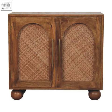 Brown wooden arched rattan two-door sideboard with woven cane panels brass handles and rounded ball feet