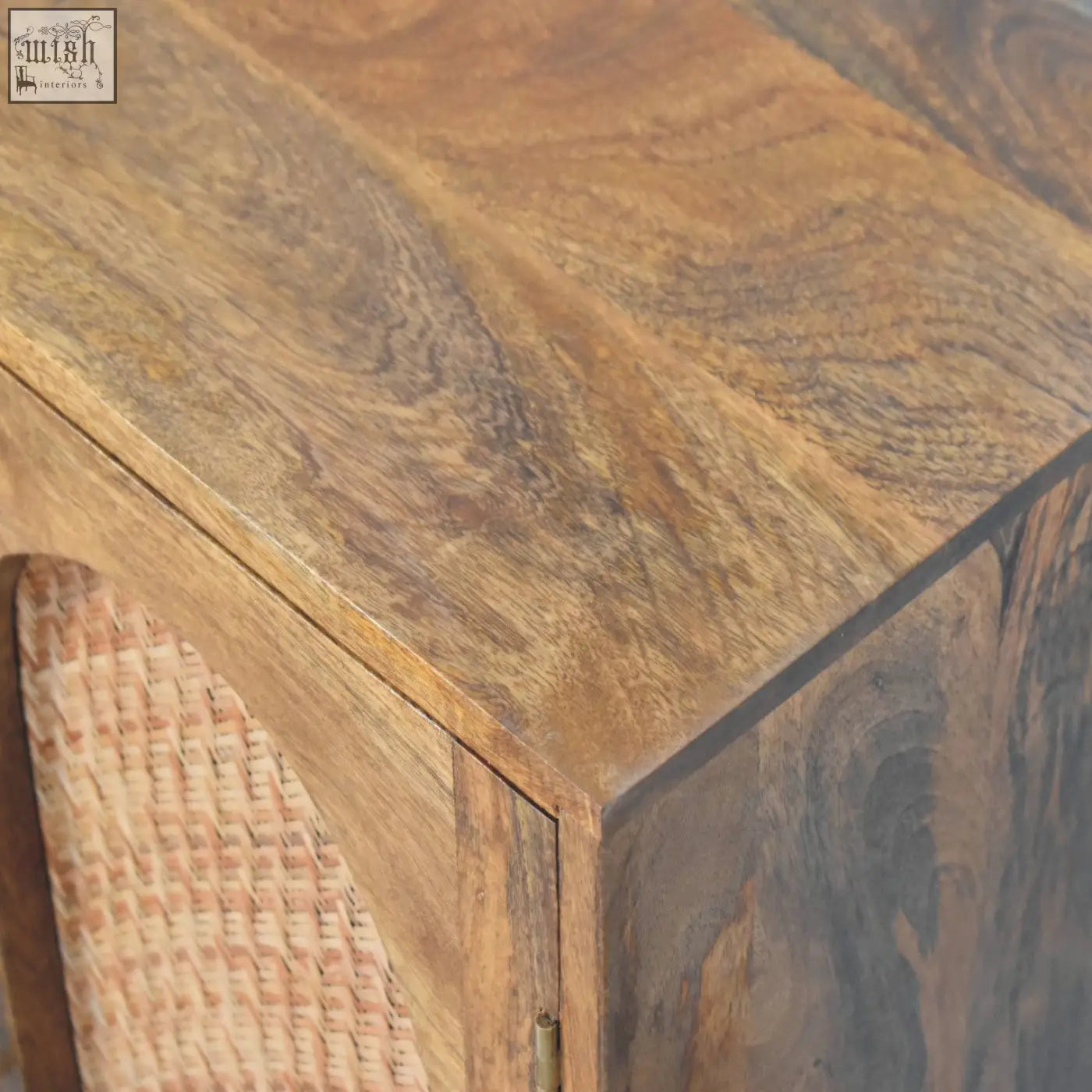 Arched rattan two-door sideboard with rustic wooden cabinet in warm natural finish and visible grain patterns