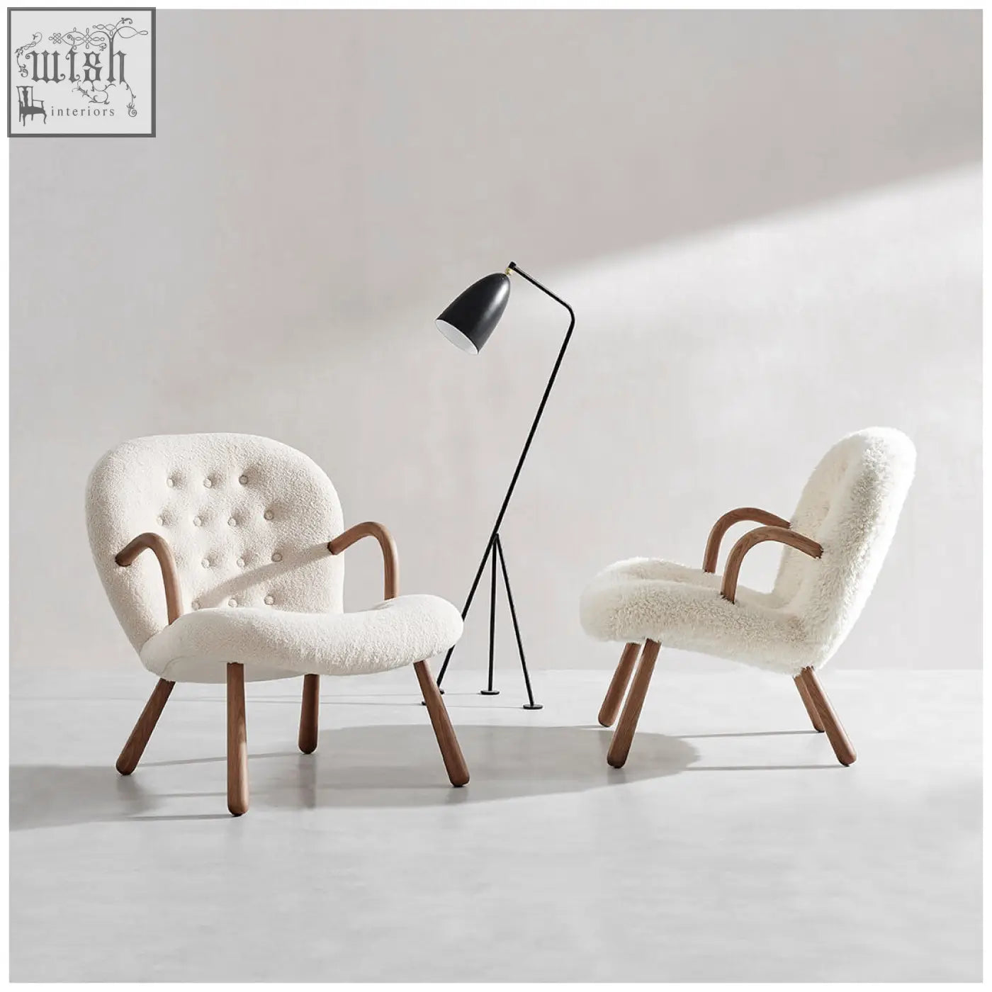 Cream-colored arctander clam armchair with tufted backrest curved wooden arms long hair sheepskin upholstery