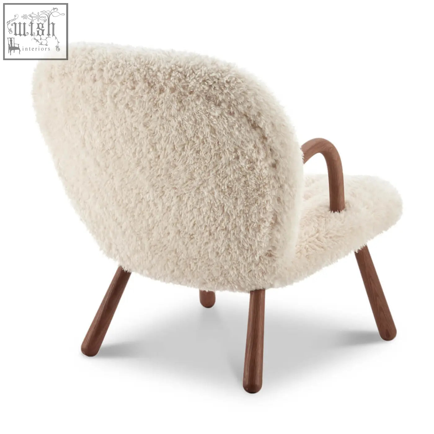 Cream-colored arctander clam armchair with long hair sheepskin and curved wooden legs and handles