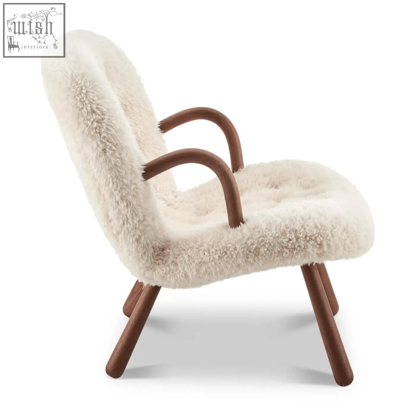 Cream-colored arctander clam armchair with sheepskin upholstery and curved wooden arms and legs