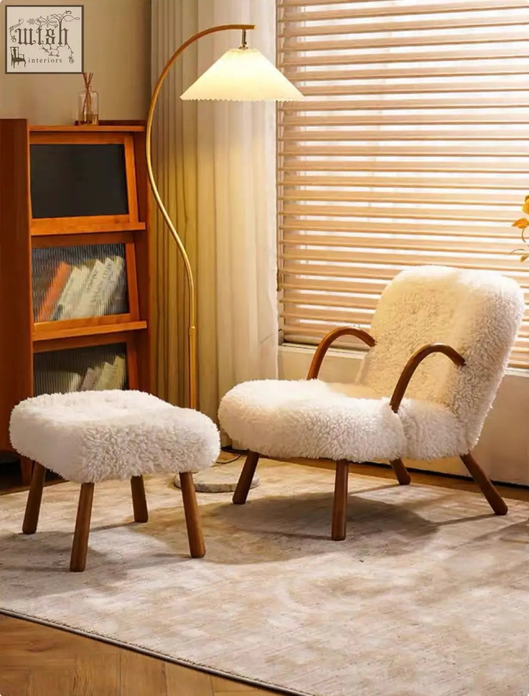 Cream-colored arctander clam armchair sheepskin with curved wooden legs and matching ottoman for cozy seating