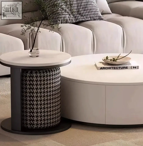 Circular coffee table with white marble top and black and white houndstooth footstool coffee table offers style