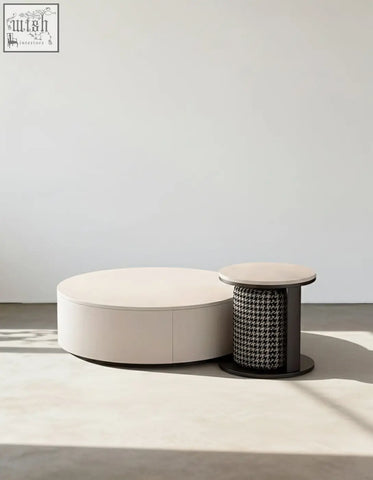 Cream-colored oval marble coffee table with a sleek design and subtle seam detail from aria coffee table offers set