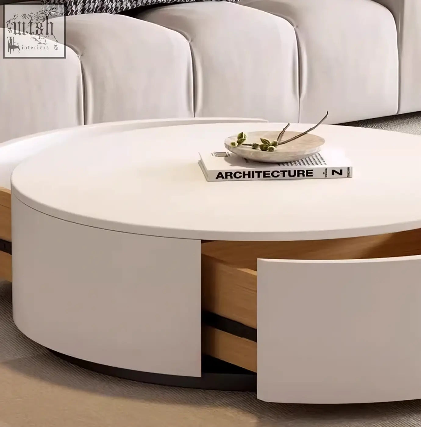 Modern white oval coffee table with light wood accents and integrated drawers as part of aria marble coffee table set with stool