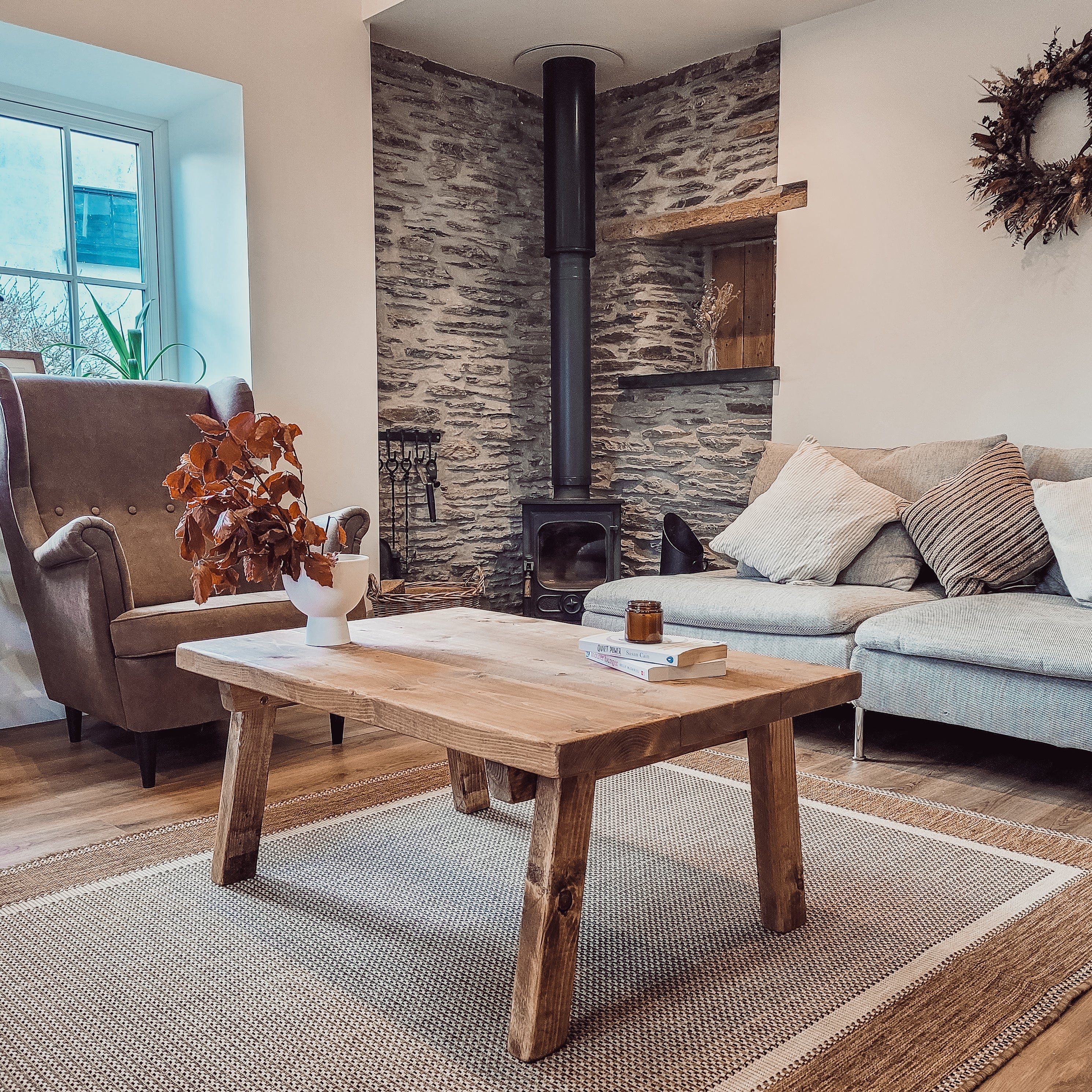 Aria rustic wooden coffee table with thick natural finish legs and smooth top pictured table perfect for living rooms