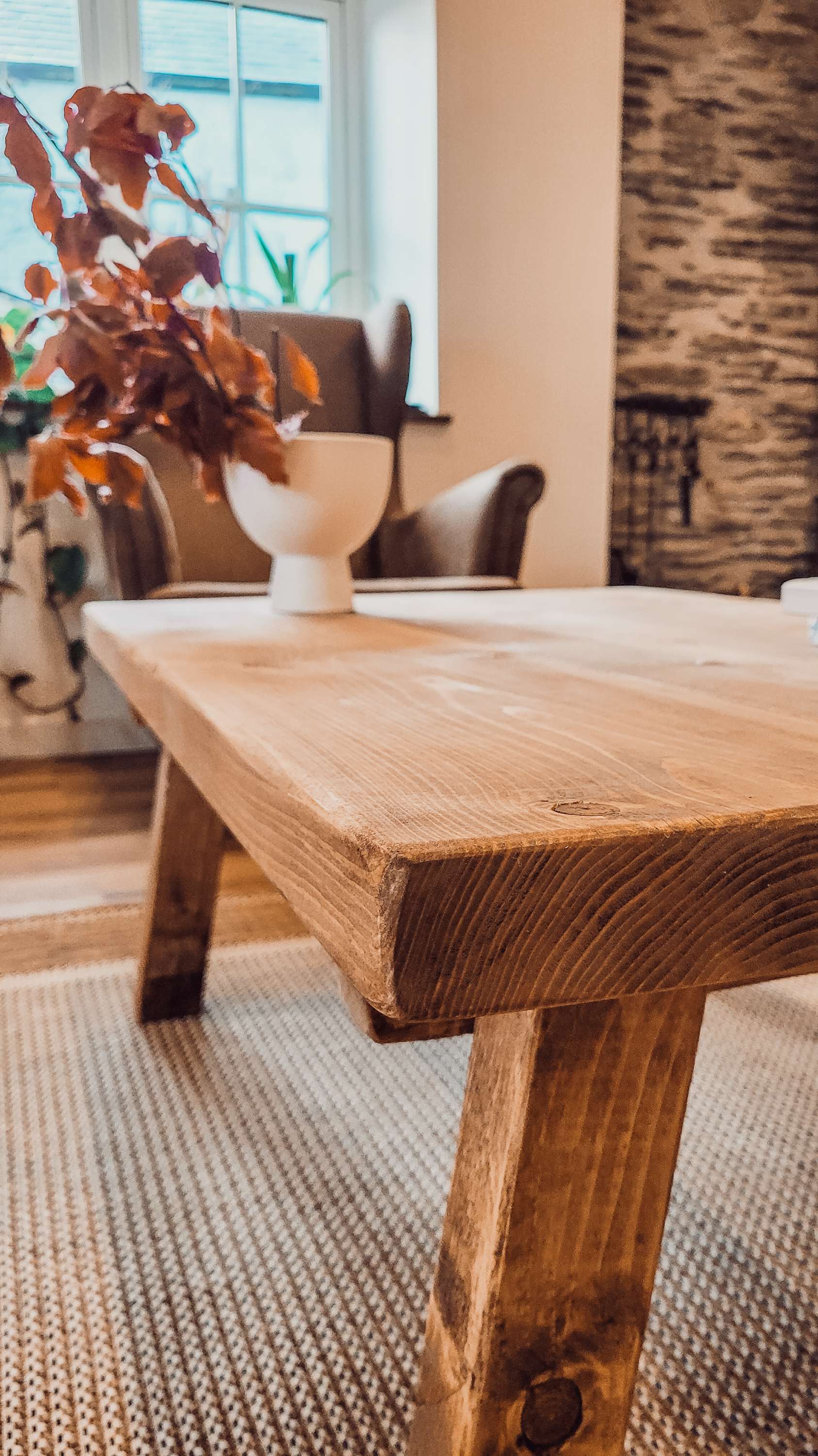 Rustic wooden coffee table aria rustic with visible grain and sturdy legs shown in pictured table design