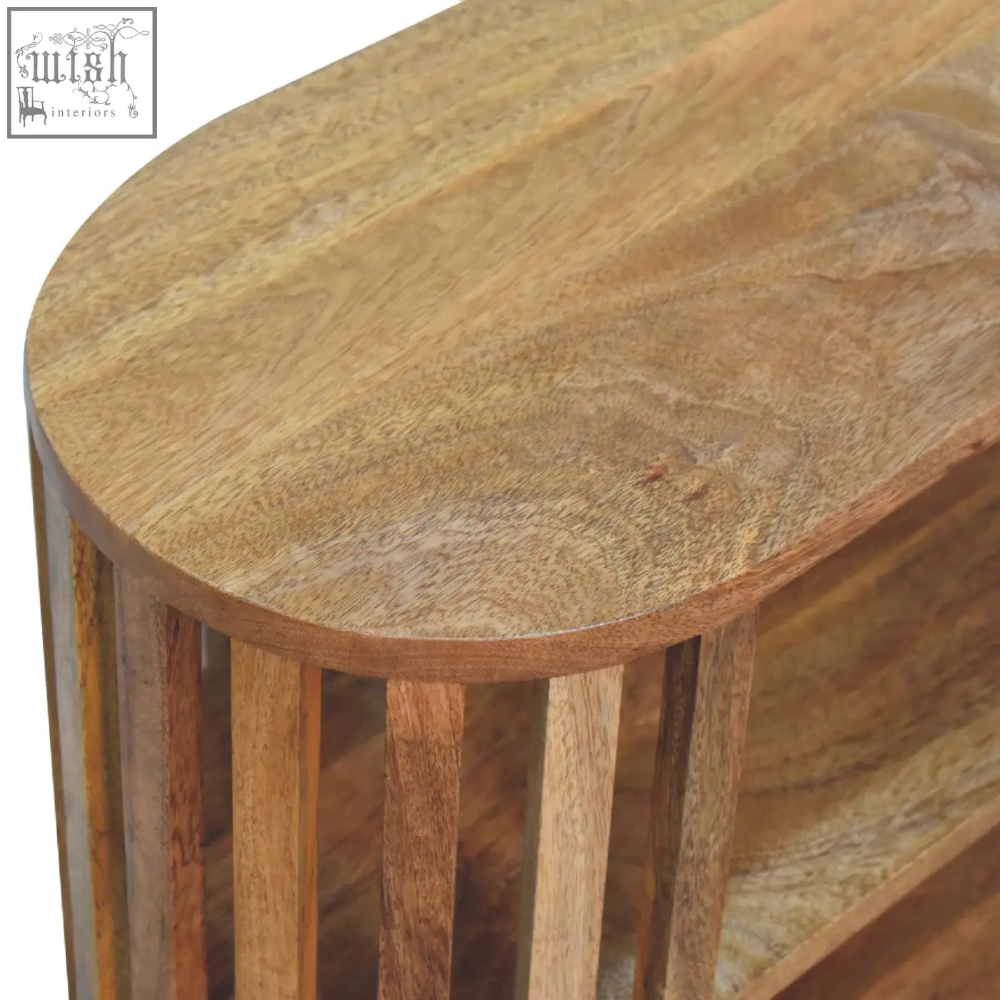 A rustic ariella chest side table with an oak-ish finish crafted from warm mango wood with natural grain patterns