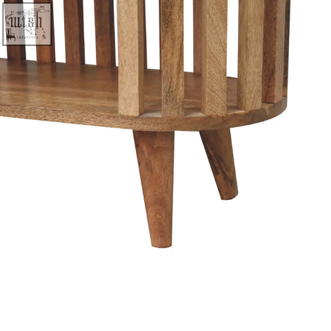 Ariella chest of drawers in oak-ish mango wood with a curved top and japanese design tapered legs