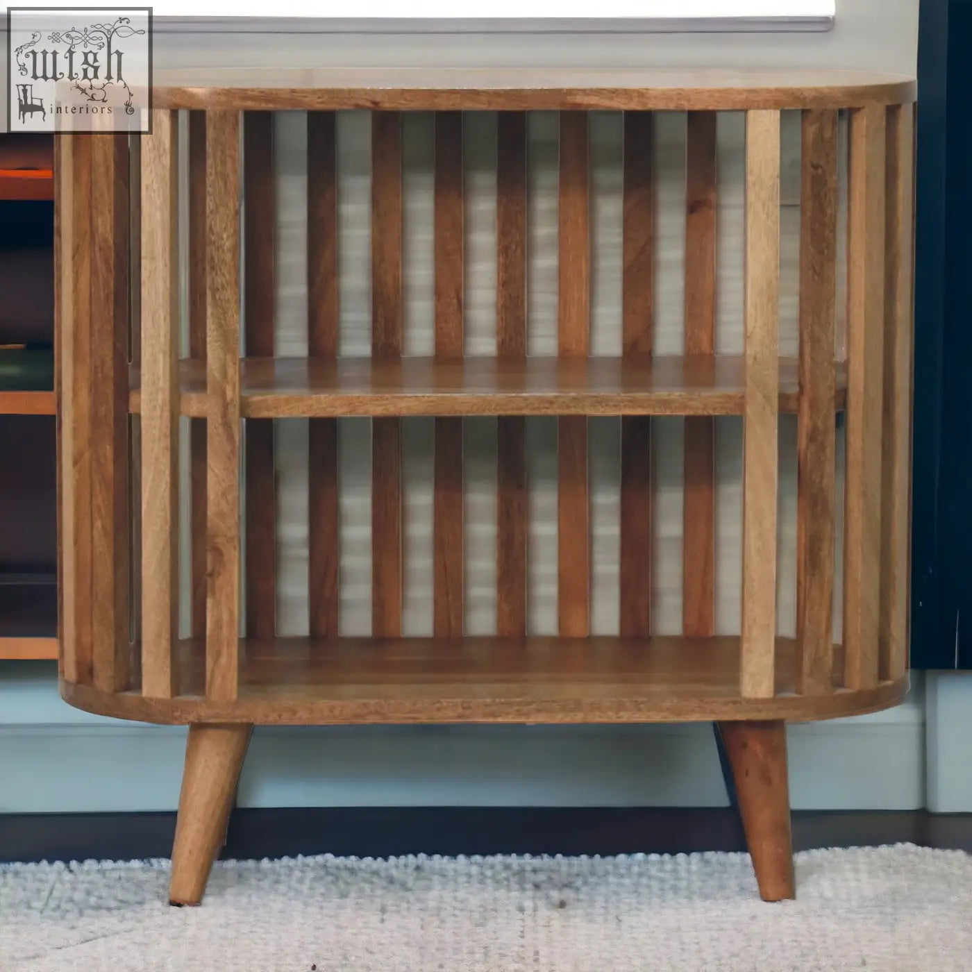 Ariella chest of drawers with curved slats and tapered legs in oak-ish mango wood featuring japanese design