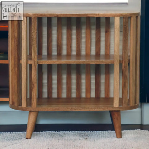 Ariella chest of drawers with curved slats and tapered legs in oak-ish mango wood featuring japanese design