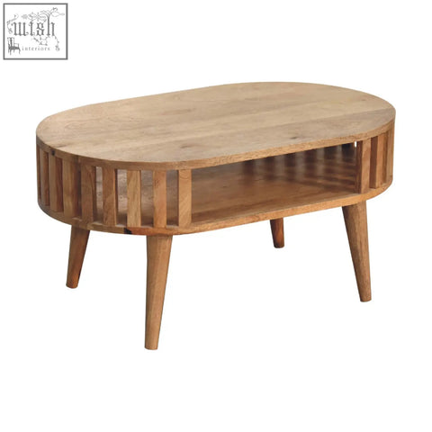Light brown ariella coffee table with slatted sides and tapered legs made from solid mango wood