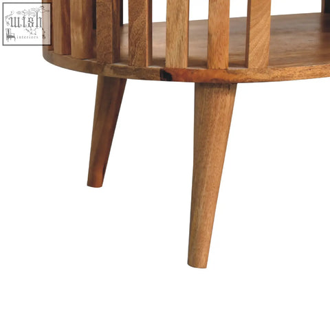 Ariella coffee table round wooden coffee table with vertical slats and tapered legs made of solid mango wood