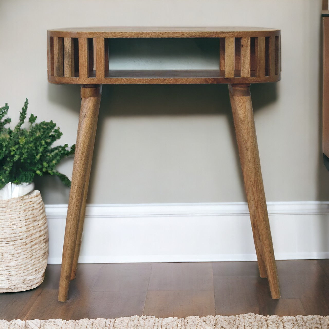 Ariella console table featuring a sleek light brown wooden design with slatted top and tapered legs