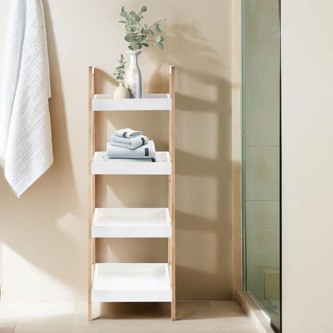 Arla four tier birch wood bathroom shelf unit in white and light wood with folded towels and eucalyptus vase on tiers