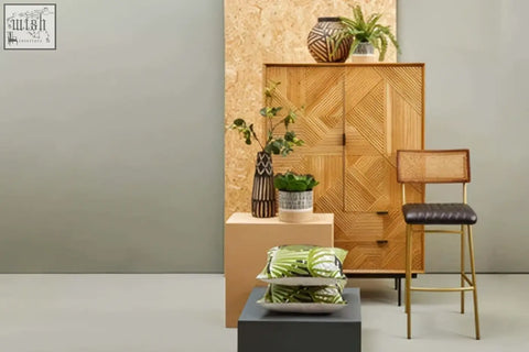 Woven rattan cabinet with geometric pattern and natural wood finish shown with small engraved wooden vase arlo design