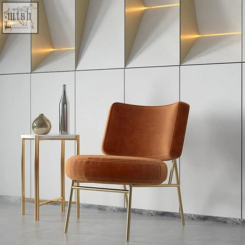 Aron dining chair velvet in warm orange with sleek gold metal frame perfect for stylish dining seating