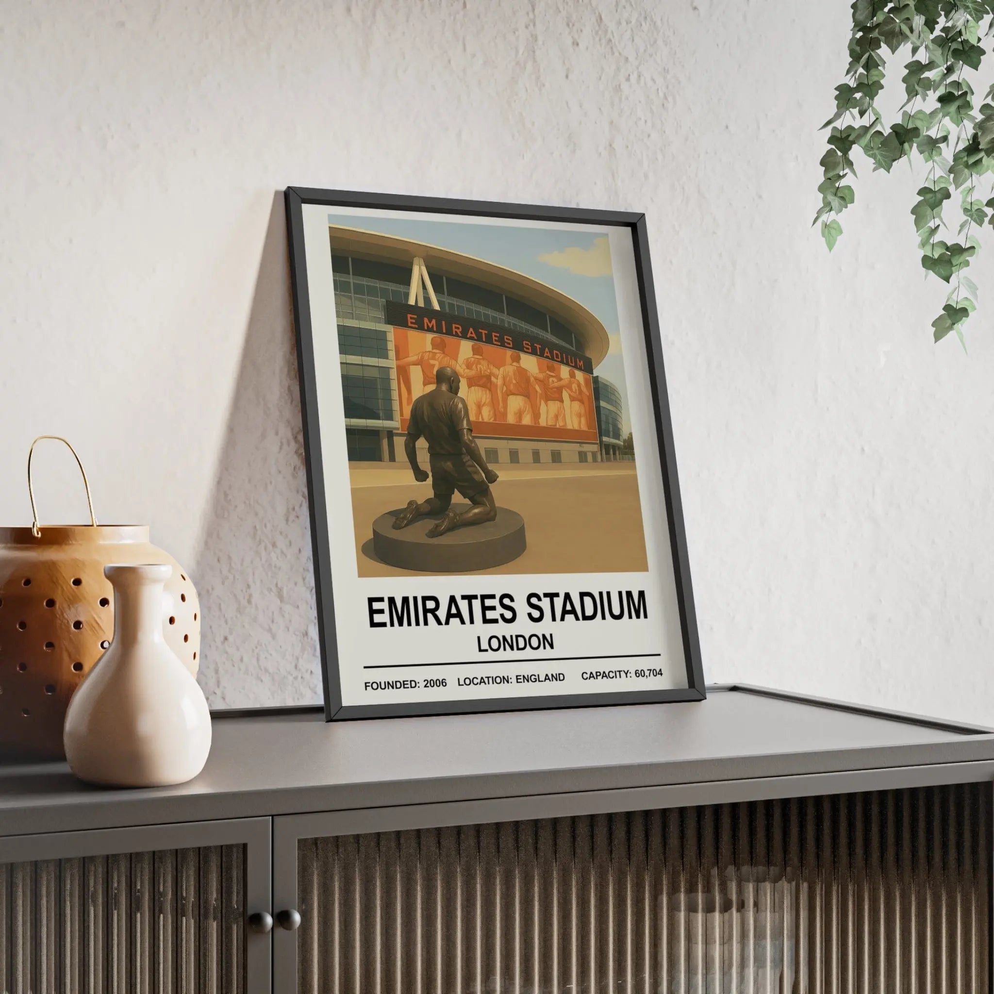 Black-framed arsenal emirates stadium print with vintage orange-toned illustration of emirates stadium london facade