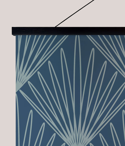 Blue wall hanging with light gray fan shapes on dark blue background framed in black art deco burst deco burst tapestry