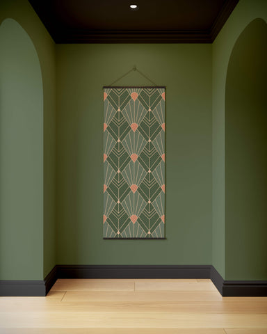 A rectangular art deco diamond pattern tapestry with green and peach geometric design framed in black