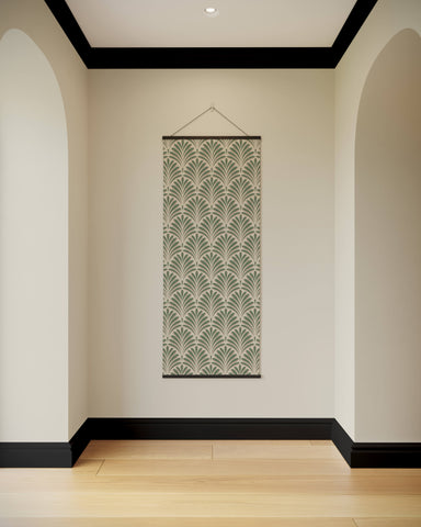 A vertical art deco fan tapestry with muted green and cream fan patterns framed by dark wood borders