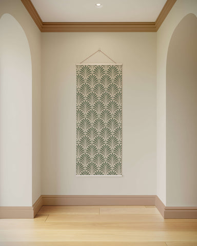 A vertical art deco fan tapestry with repeating fan motifs in muted sage green and cream framed by a white border
