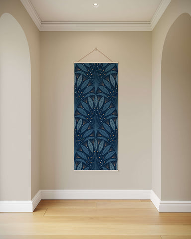 A navy blue art deco leaf fan tapestry with intricate leaf and dot patterns and a thin white border hanging on wall