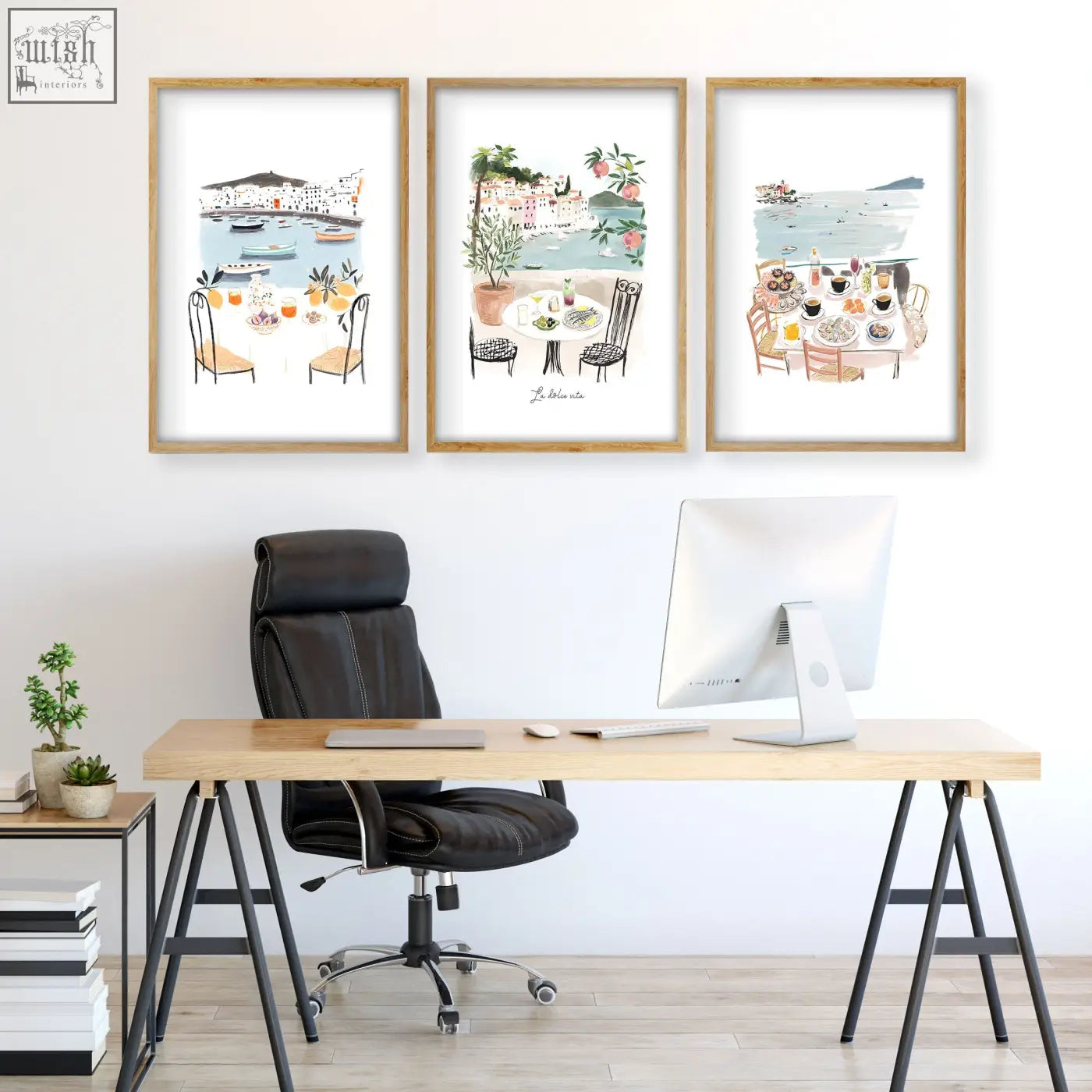 Set of three framed watercolor art prints featuring mediterranean coastal dining scenes in light wood frames