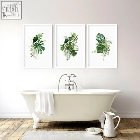 Set of 3 framed tropical wall prints with lush green leaves on white backgrounds perfect for bathroom walls uk