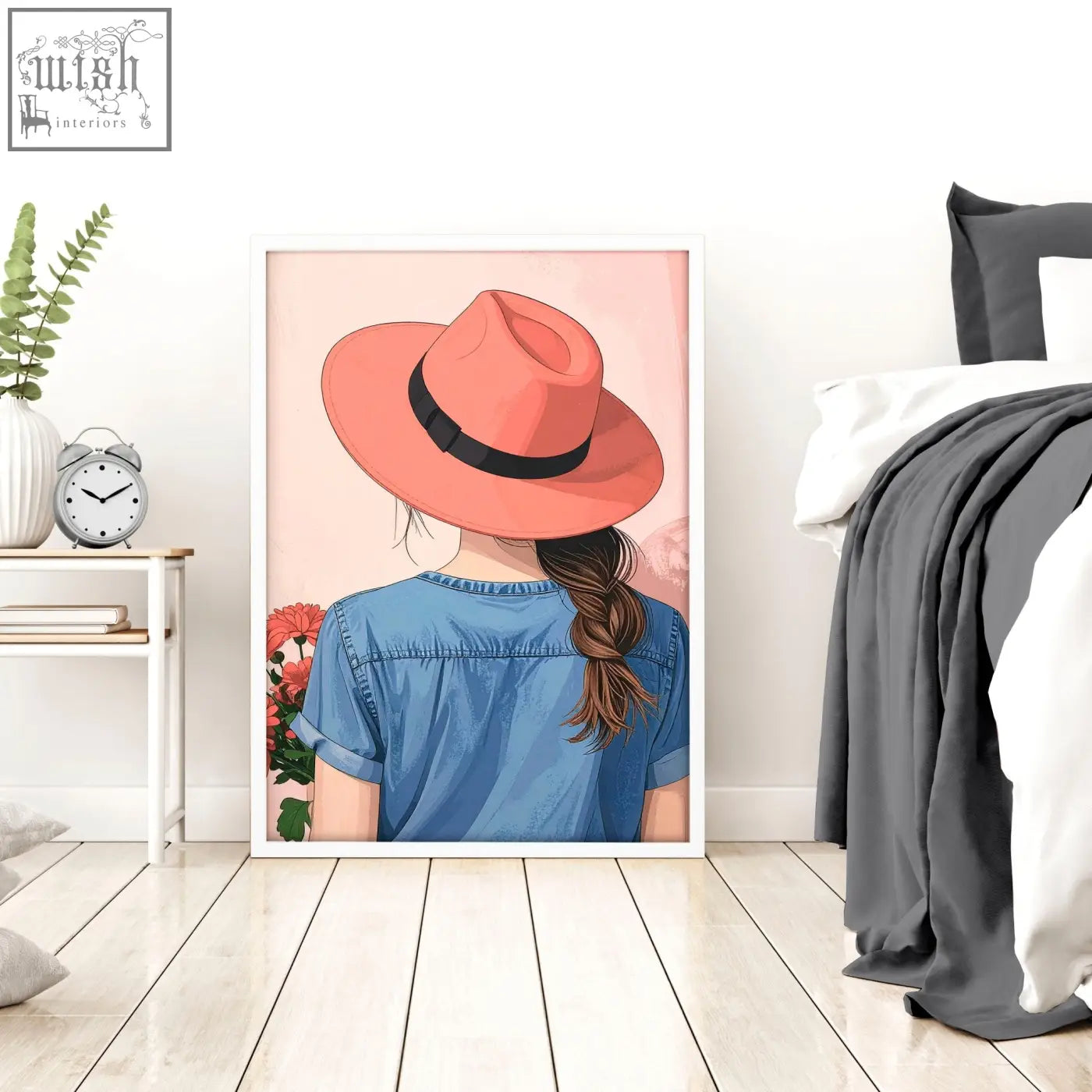 A framed wall art print of a woman in a coral fedora and blue denim shirt perfect for boho women wall decor