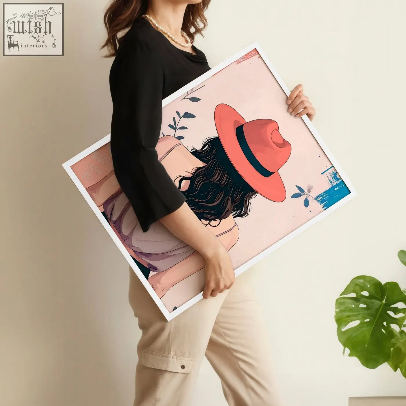 A framed boho women wall art print of a woman with dark hair and a coral hat on a soft pink background with leaves and butterflies
