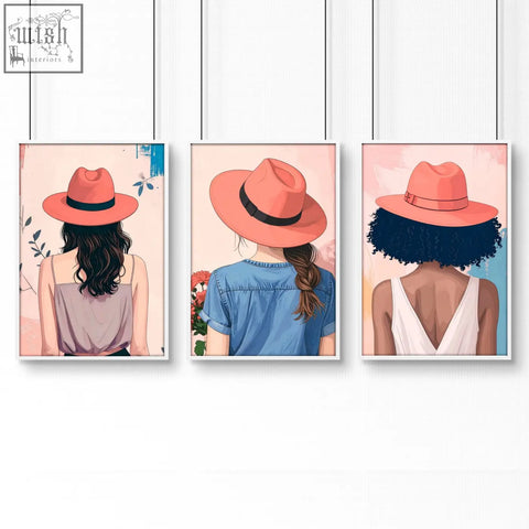 Set of three boho women wall art prints featuring framed illustrations of women wearing coral fedoras for bedroom decor