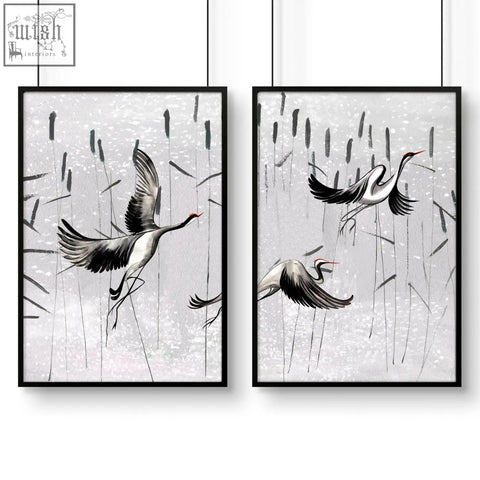 Black-framed japanese art prints featuring white and gray cranes in flight on silver-gray textured wall art set for bedrooms