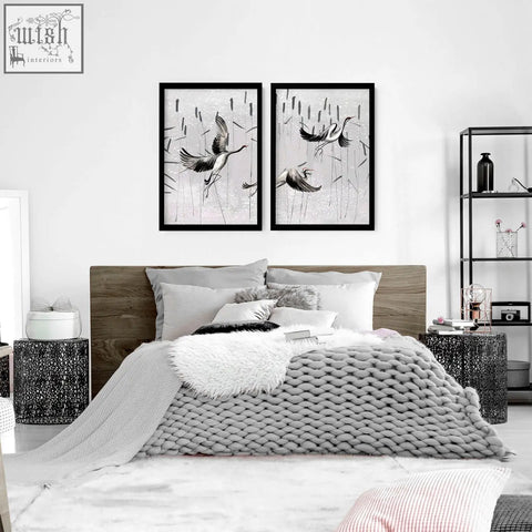 Set of 2 black-framed japanese art prints featuring stylized white cranes in flight on textured monochrome wall art