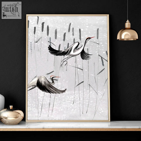 A set of 2 japanese art prints featuring white cranes with red beaks in gold-toned frames perfect for bedroom wall art