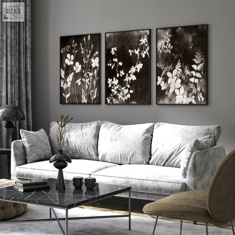 Silver velvet sofa with plush cushions pairs perfectly with mink botanical dark floral wall art for living room wall decor