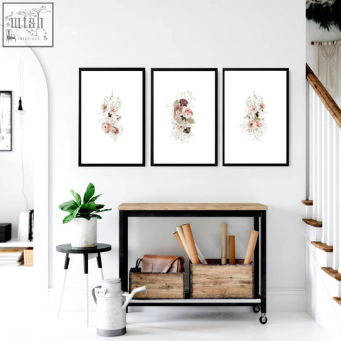 Three shabby chic wall art prints with delicate pink and peach watercolor blossoms in black frames for kitchen decor