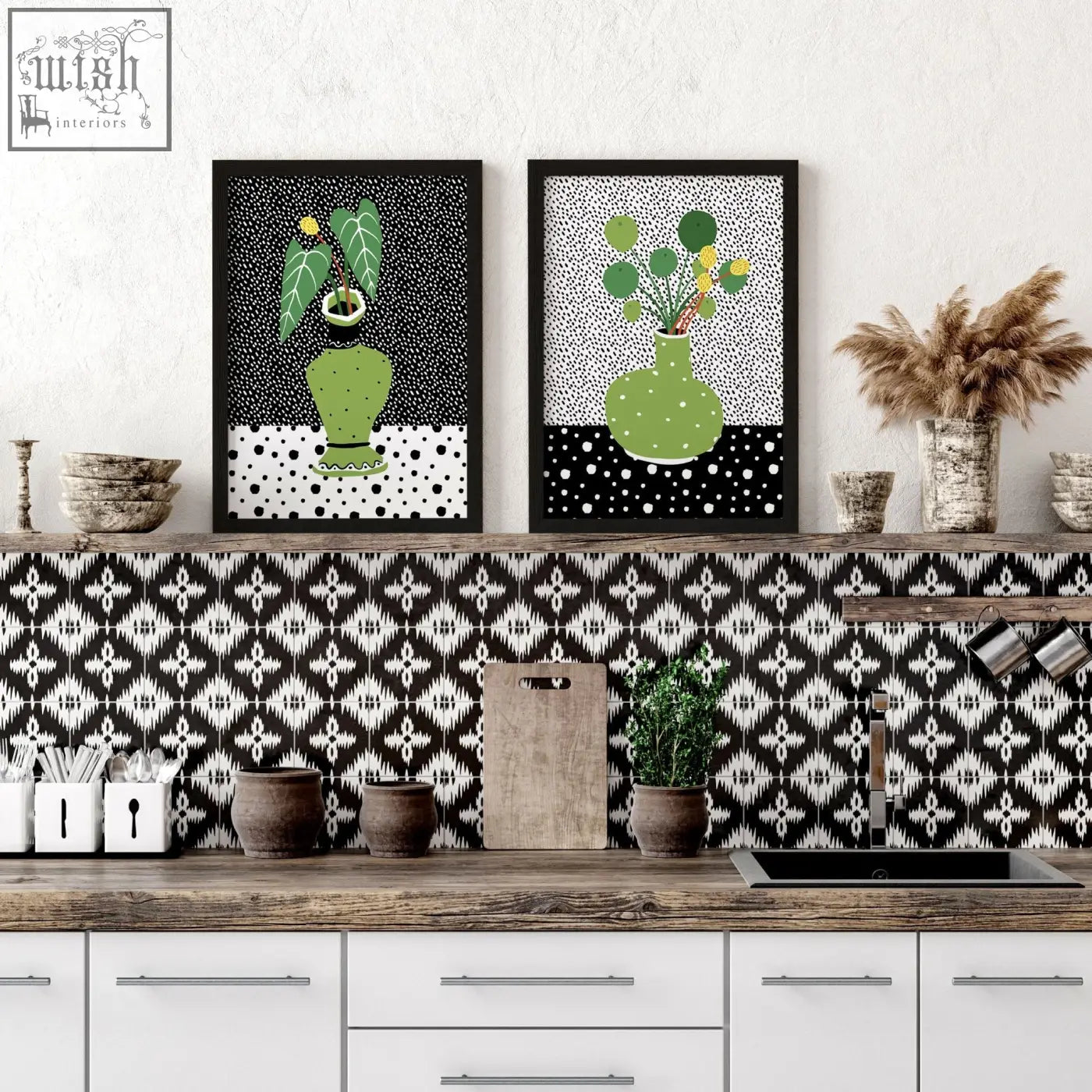 Two framed wall art poster prints featuring green vases with leafy plants in black frames on dotted background