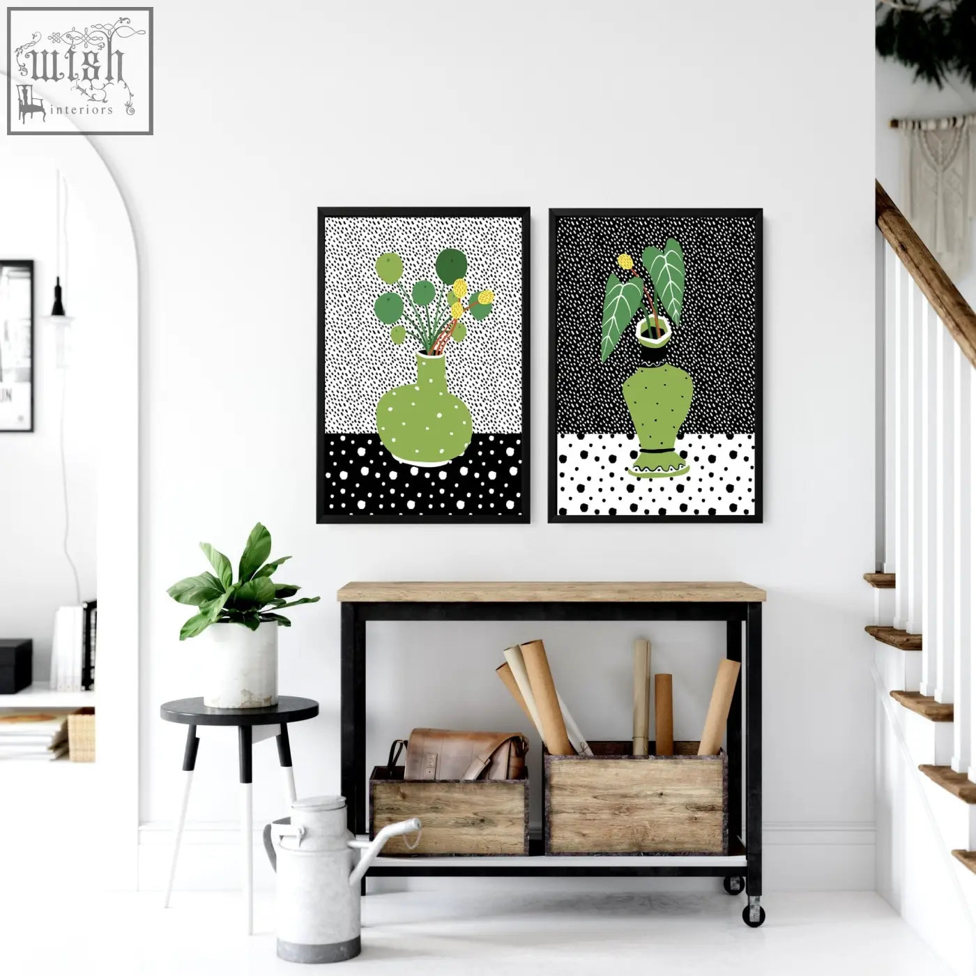 Two framed wall art poster prints featuring green vases with plants on black and white polka dot backgrounds