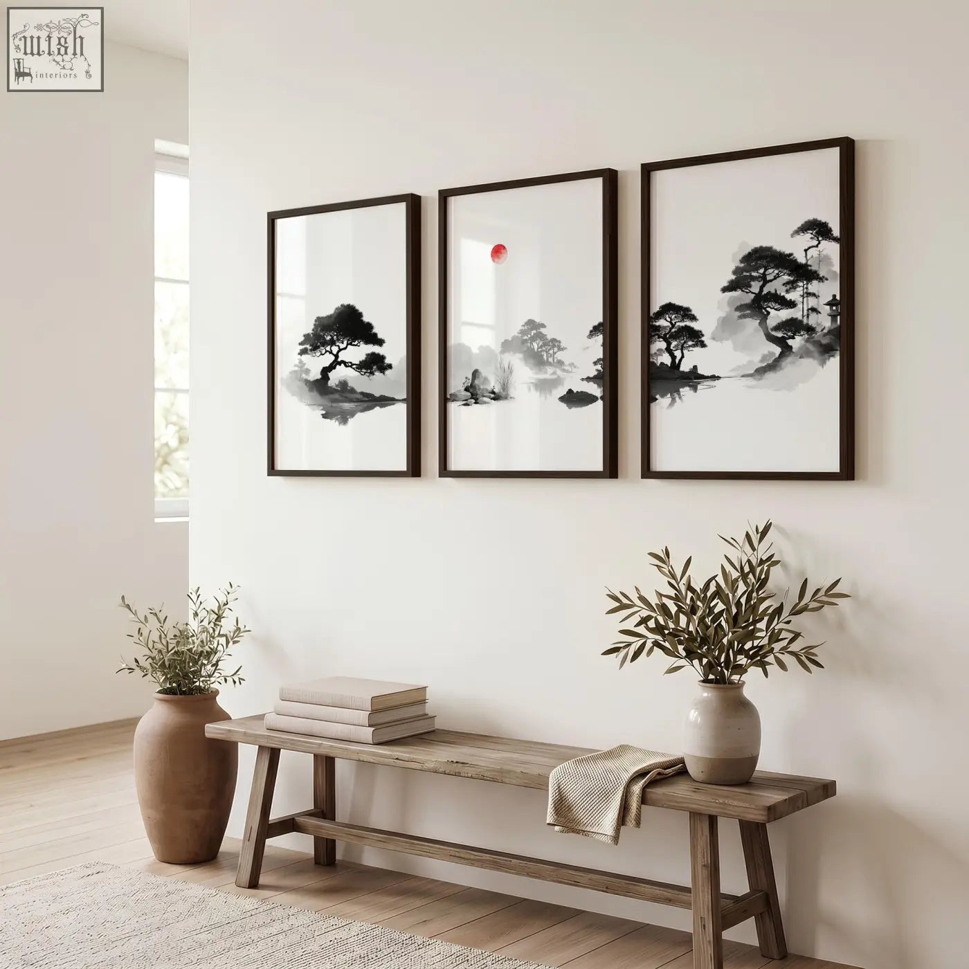 Three framed black and white japanese ink wash art landscape paintings with a red sun displayed above a wooden bench