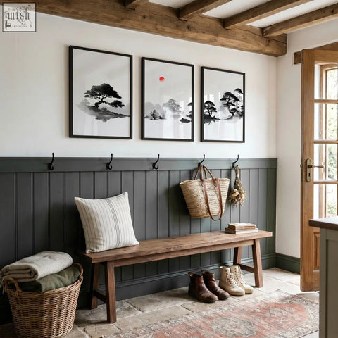 Rustic wooden bench with striped pillow and dark gray paneling beneath art landscape painting set of 3