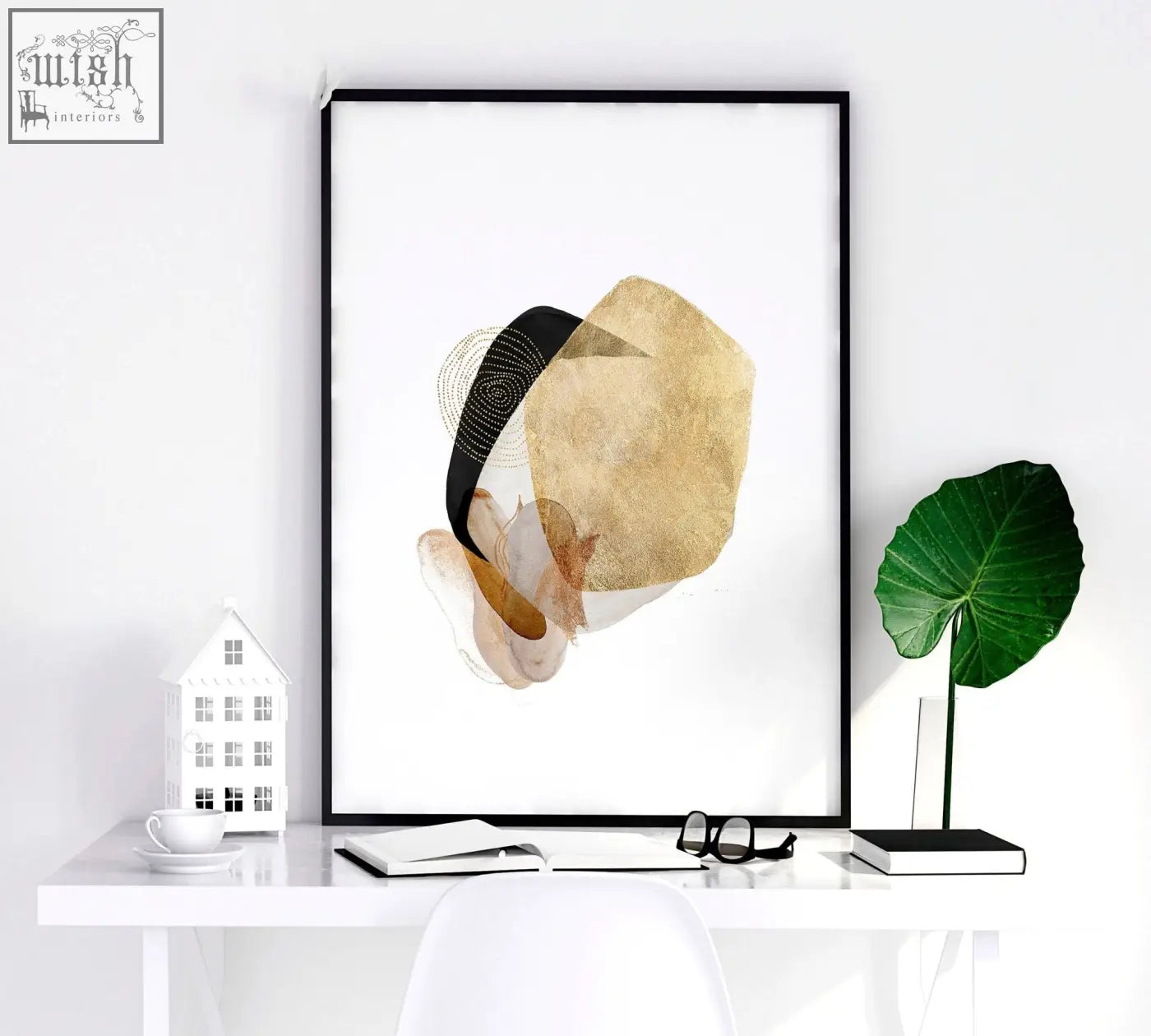 Abstract art prints in sleek black frames featuring gold and beige geometric shapes for modern bedroom wall art