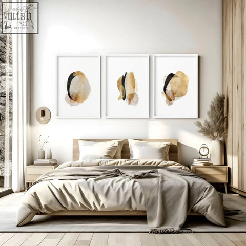 Three framed abstract art prints with gold black and beige watercolor splashes perfect for modern bedroom decor