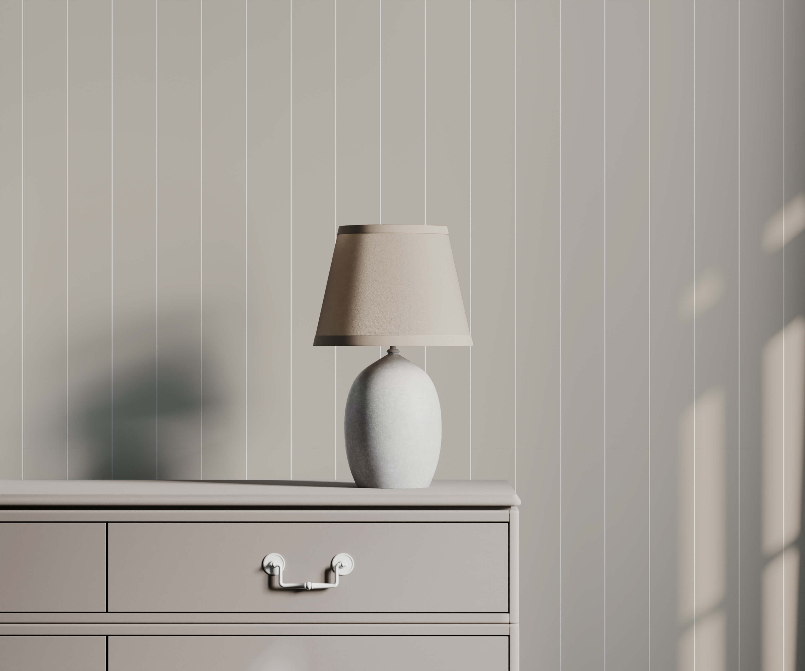 Arthur minimalist white ceramic table lamp with beige fabric shade on dresser complements minimal pinstripe wallpaper