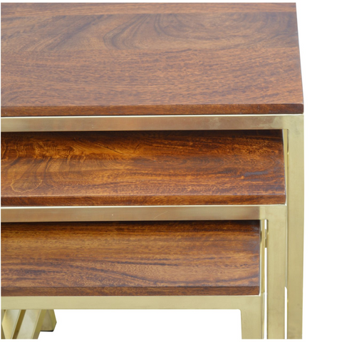 Set of three nested wooden tables with brass frames made from solid mango wood for stylish stool set use