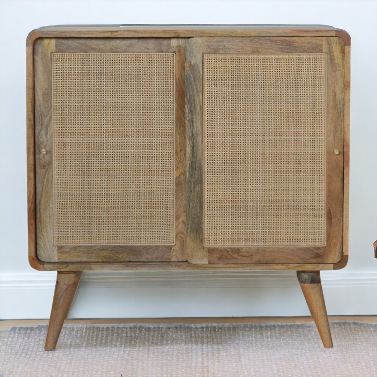 Artisan furniture rustic wooden sideboard with cane-paneled doors and tapered legs made of solid mango wood