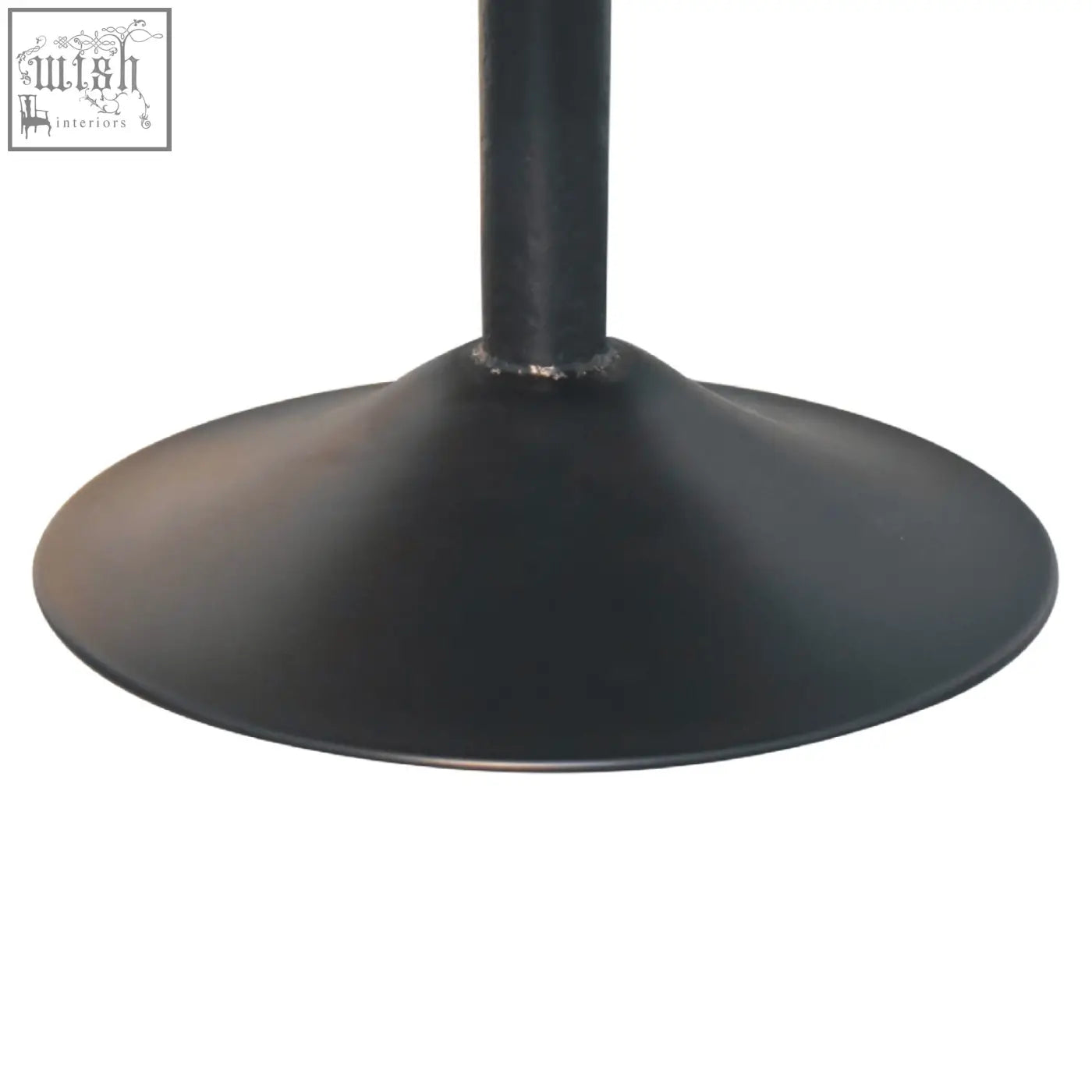 Black matte metal table base with circular flared design paired with cream boucle swivel chair from Artisan Furniture