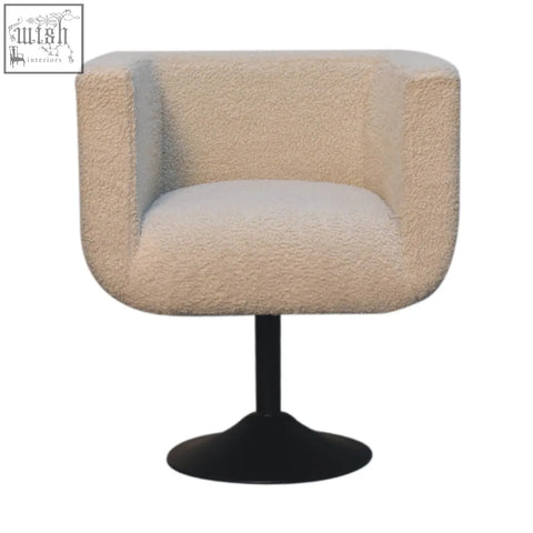 Cream boucle swivel chair with plush texture and black pedestal base from Artisan Furniture solid mango wood collection